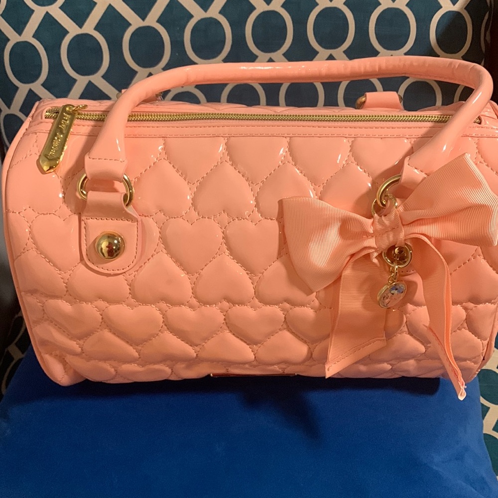 NWT - Beautiful pink color Betsey Johnson bag. Please refer to pictures.